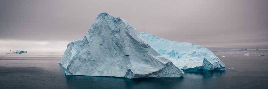 An iceberg in the middle of water